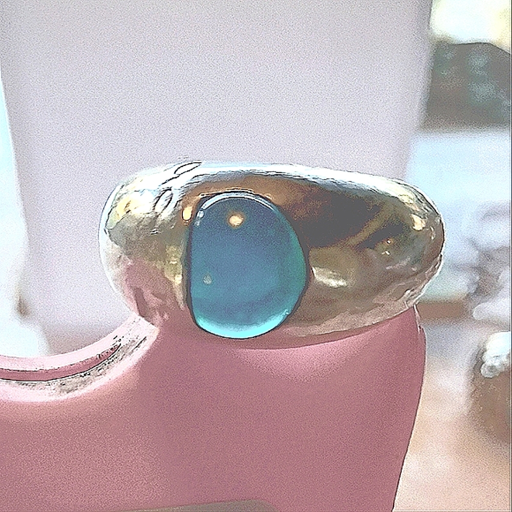 Sterling silver dome ring with a marble like turquoise stone.